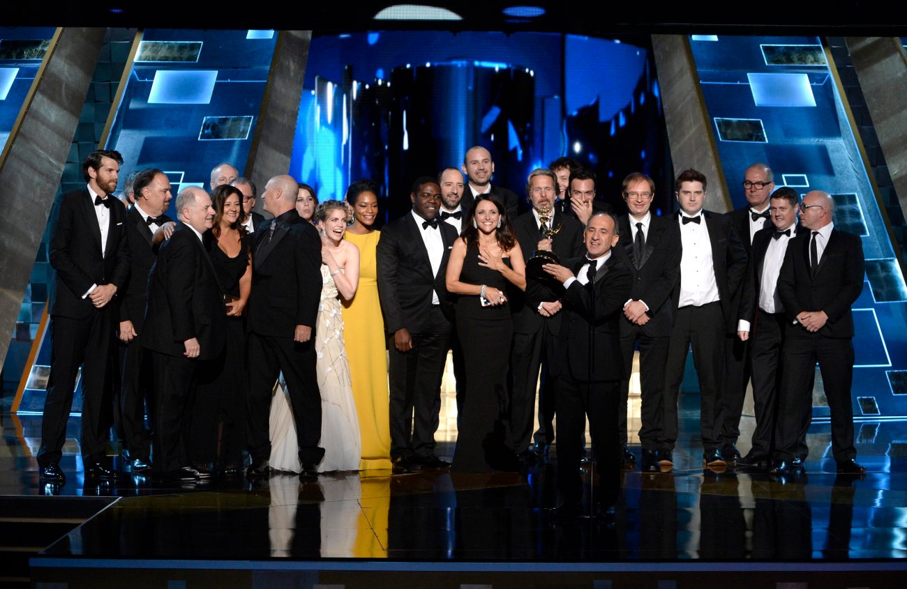 IMAGE DISTRIBUTED FOR THE TELEVISION ACADEMY - Armando Iannucci, center, and the cast and crew of "Veep" accept the award for outstanding comedy series at the 67th Primetime Emmy Awards on Sunday, Sept. 20, 2015, at the Microsoft Theater in Los Angeles. (Photo by Phil McCarten/Invision for the Television Academy/AP Images)