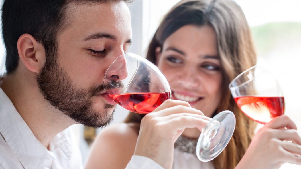 Couple enjoying wine tasting.